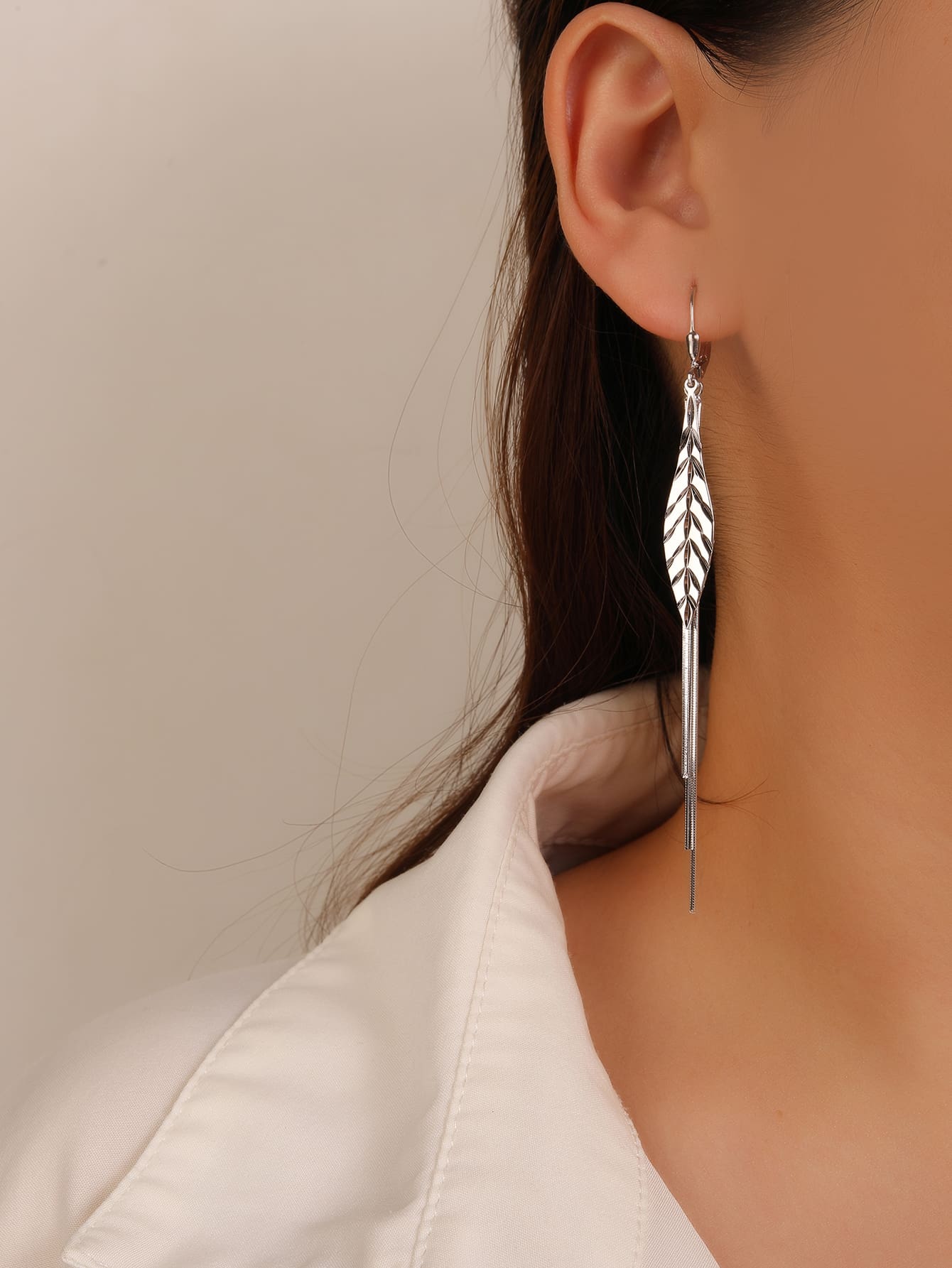 leaf-pattern dangle earrings in hallmarked, rhodium-plated 925 sterling silver – worn view – DRESCHER Jewellery®