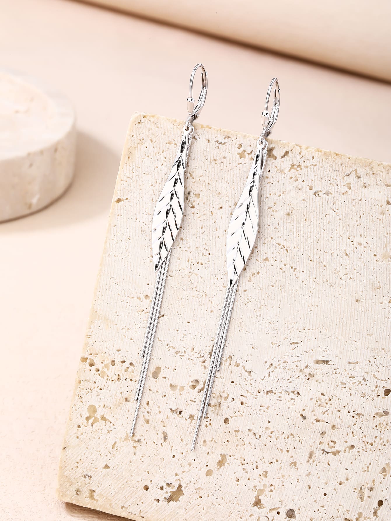 leaf-pattern dangle earrings in hallmarked, rhodium-plated 925 sterling silver – lifestyle view – DRESCHER Jewellery®