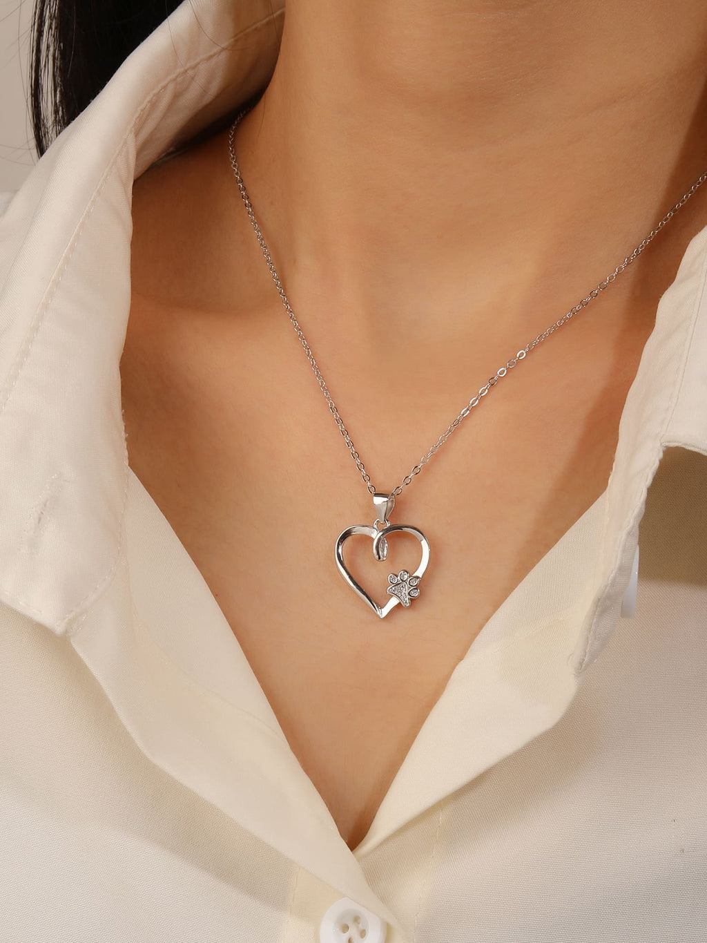 Paw in my heart silver pendant in hallmarked, rhodium-plated 925 sterling silver – worn view – DRESCHER Jewellery®