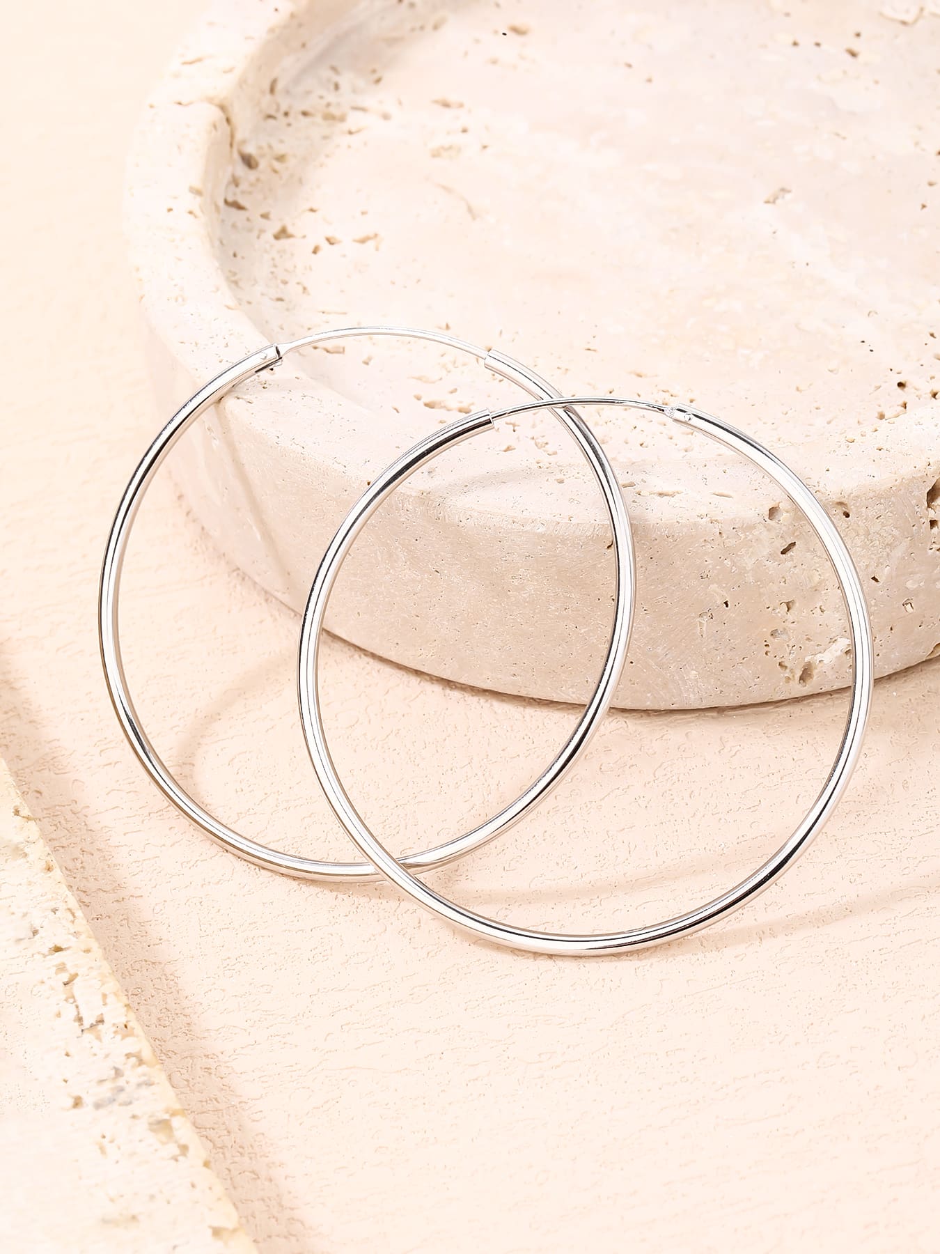 large stone-free hoop earrings in hallmarked, rhodium-plated 925 sterling silver – lifestyle view – DRESCHER Jewellery®