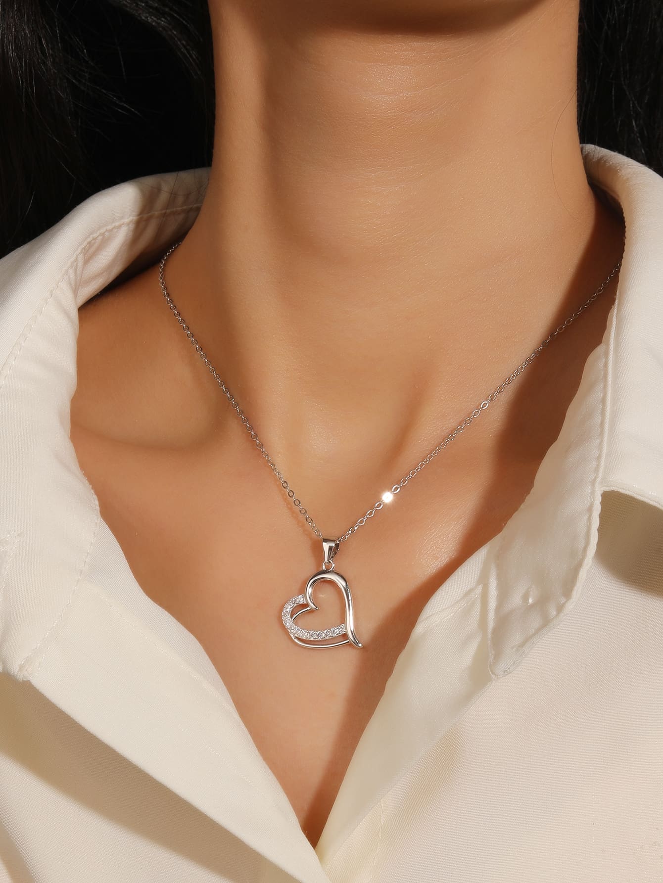 Open heart pendant with zirconia in hallmarked, rhodium-plated 925 sterling silver – worn view – DRESCHER Jewellery®