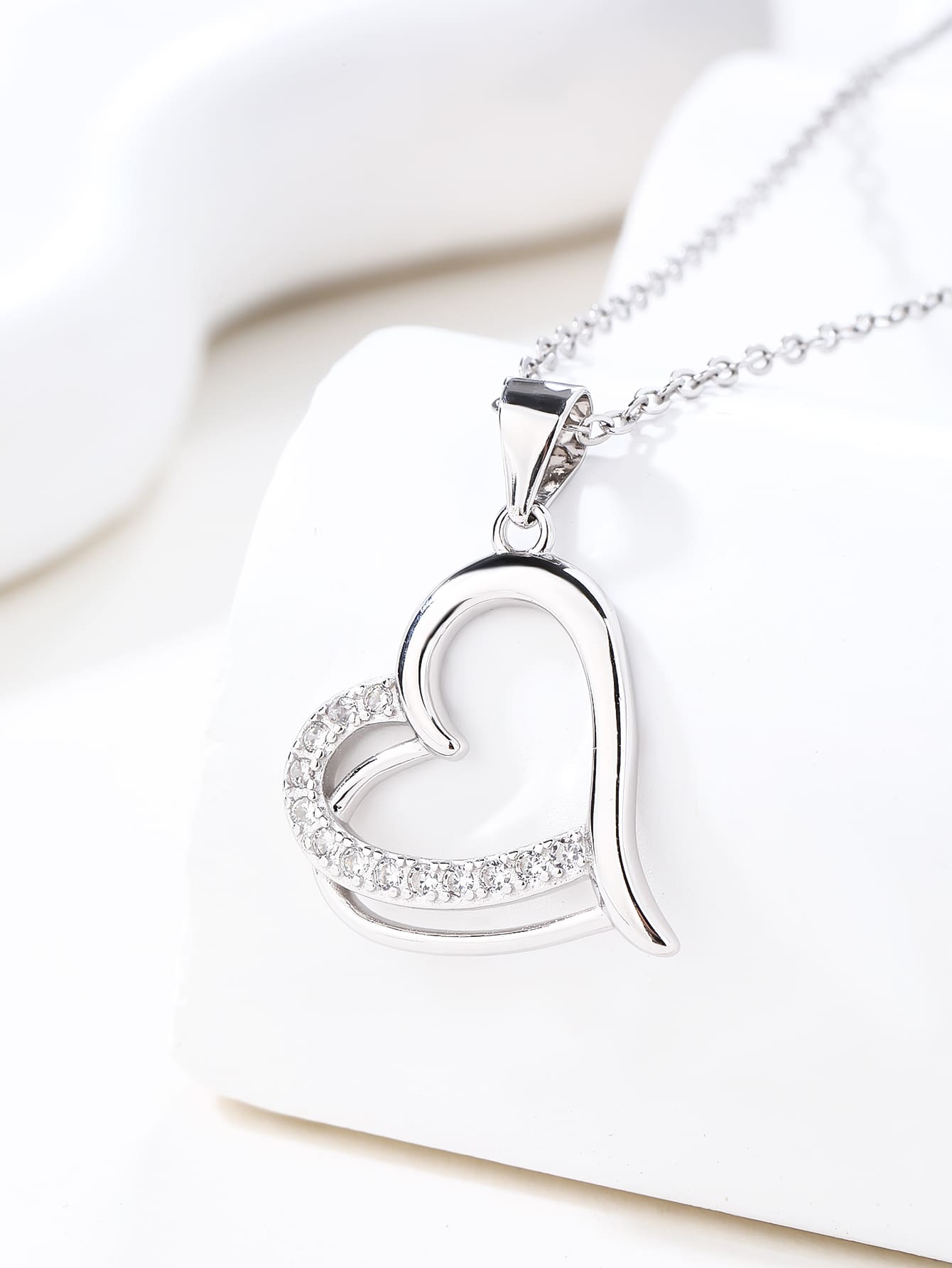Open heart pendant with zirconia in hallmarked, rhodium-plated 925 sterling silver – display view – DRESCHER Jewellery®