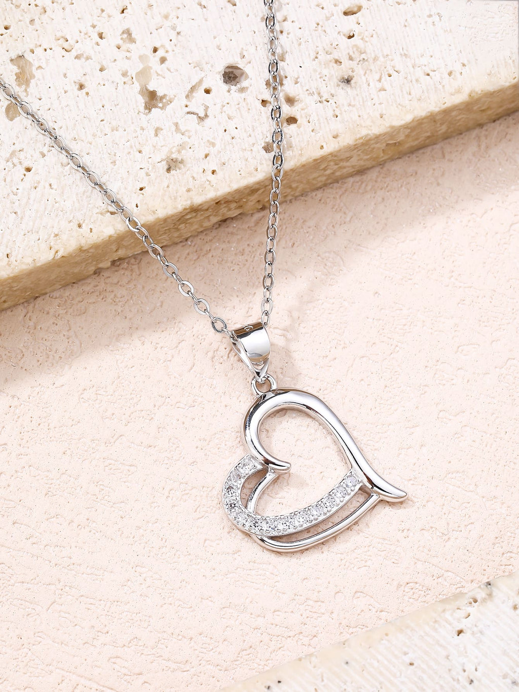 Open heart pendant with zirconia in hallmarked, rhodium-plated 925 sterling silver – lifestyle view – DRESCHER Jewellery®