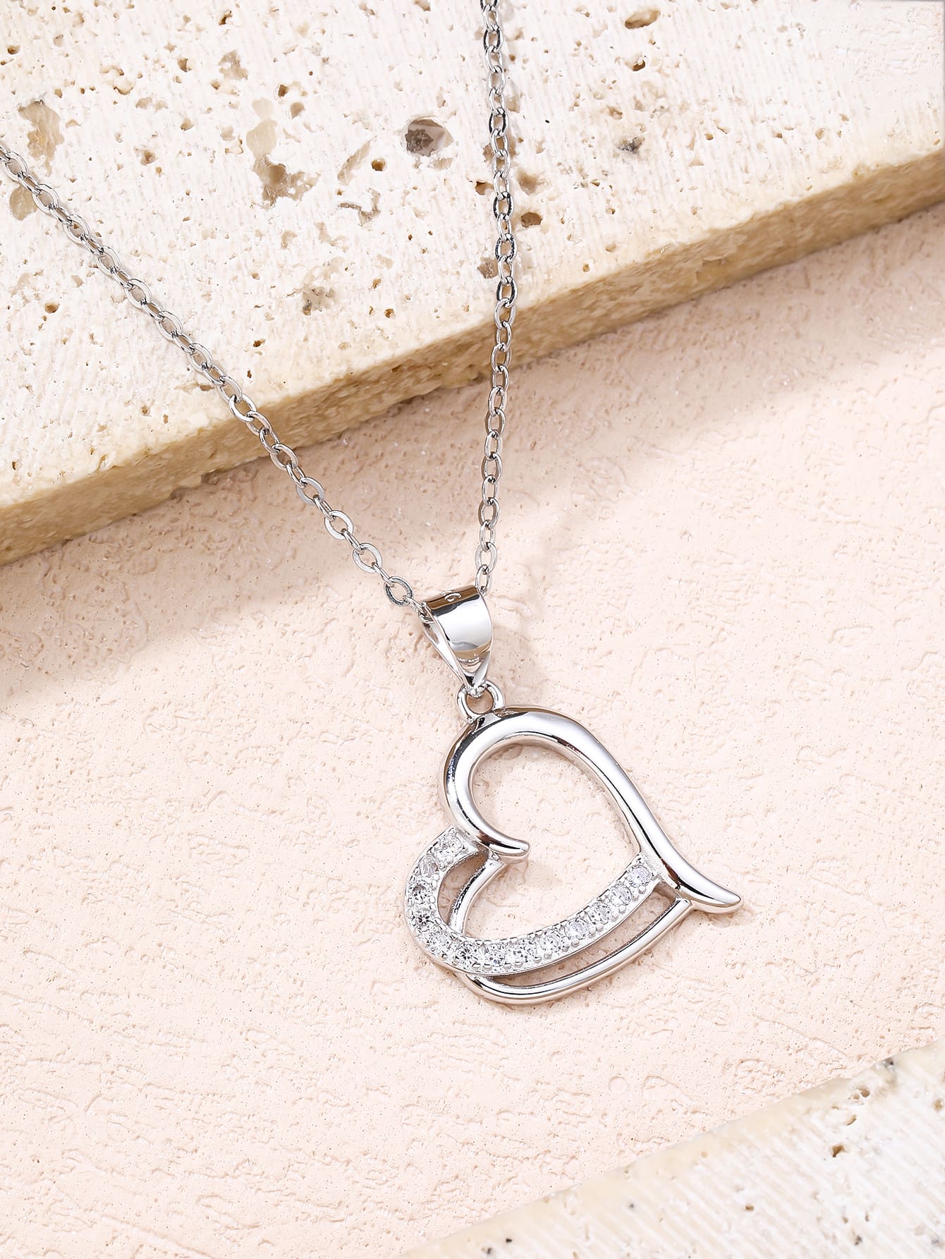 Open heart pendant with zirconia in hallmarked, rhodium-plated 925 sterling silver – lifestyle view – DRESCHER Jewellery®