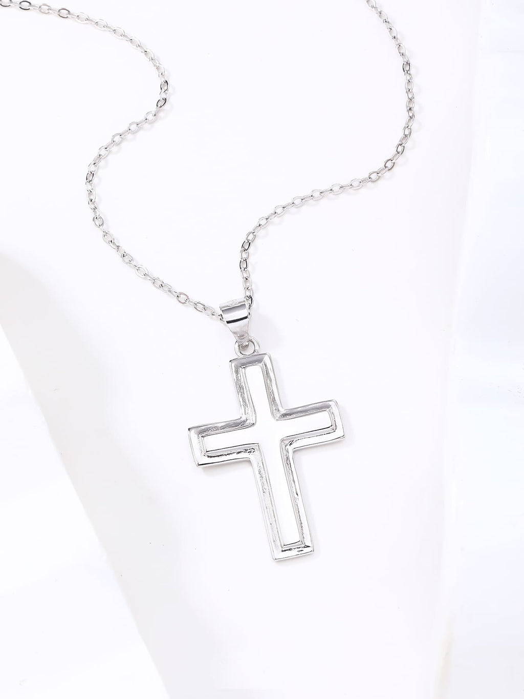 cross pendant with frame in hallmarked, rhodium-plated 925 sterling silver – lifestyle view – DRESCHER Jewellery®