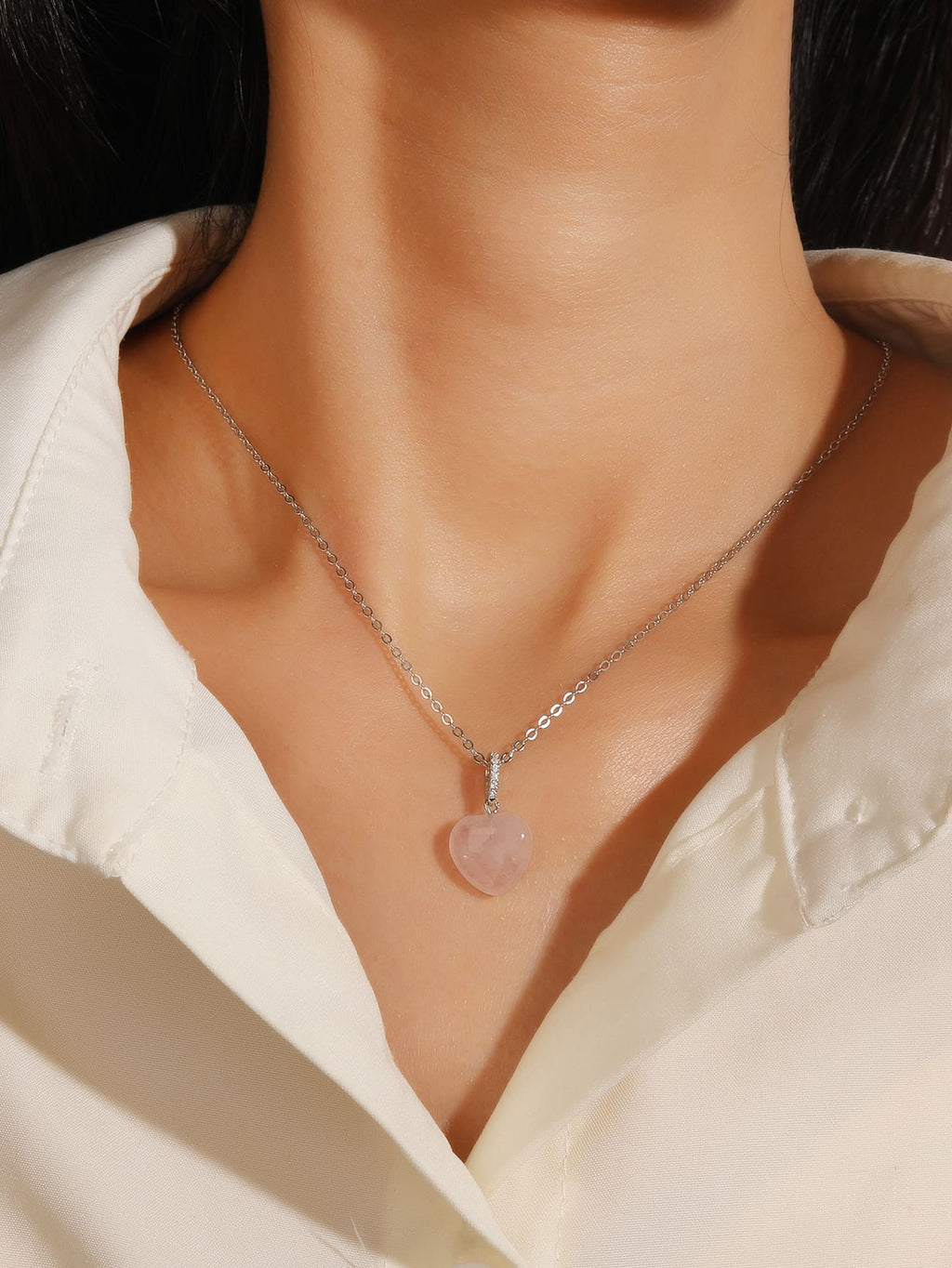 Rose Quartz Heart Pendant in hallmarked, rhodium-plated 925 sterling silver – worn view – DRESCHER Jewellery®