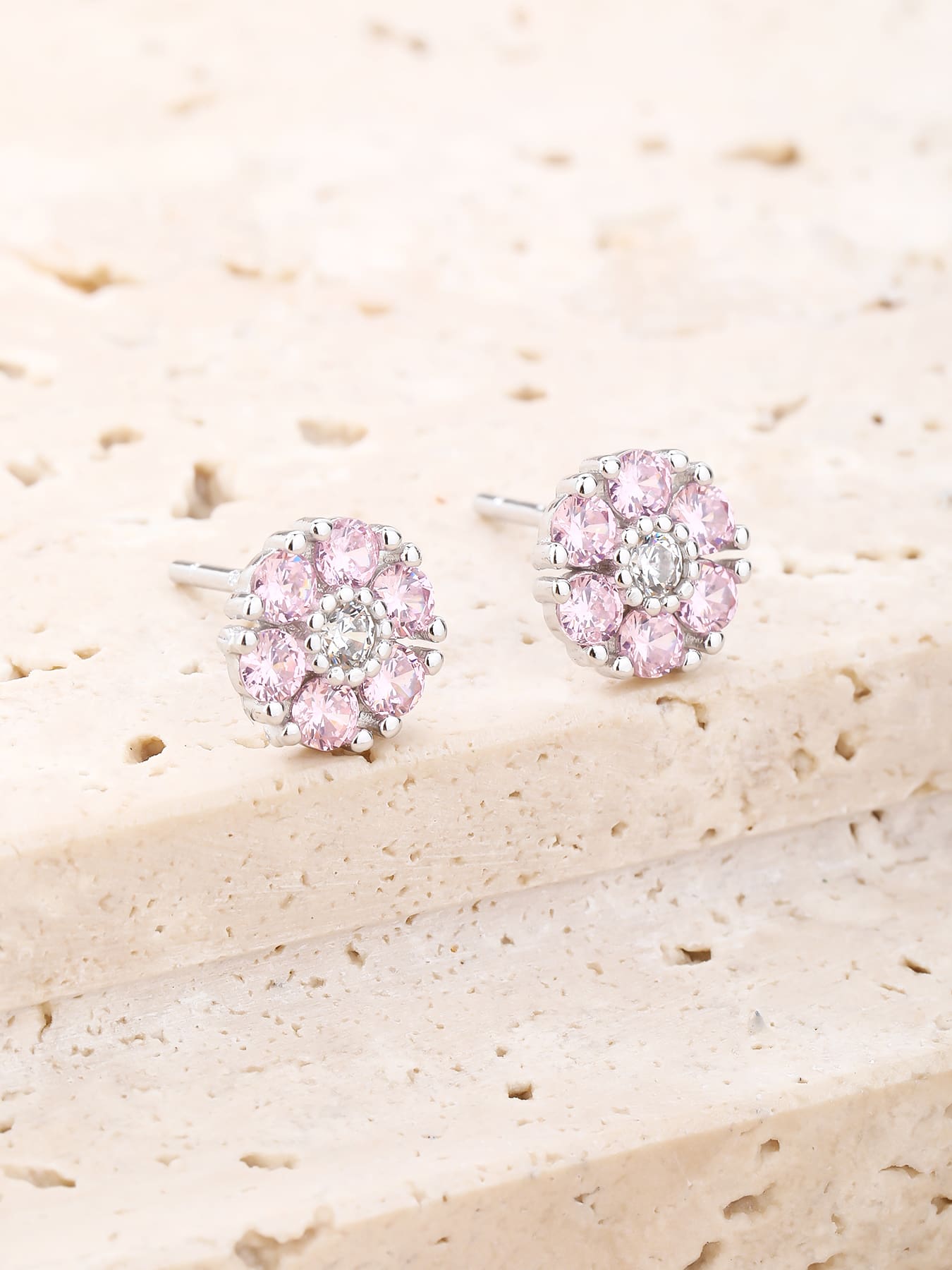 Pink and white cubic zirconia flower stud earrings in hallmarked, rhodium-plated 925 sterling silver – display view – DRESCHER Jewellery®