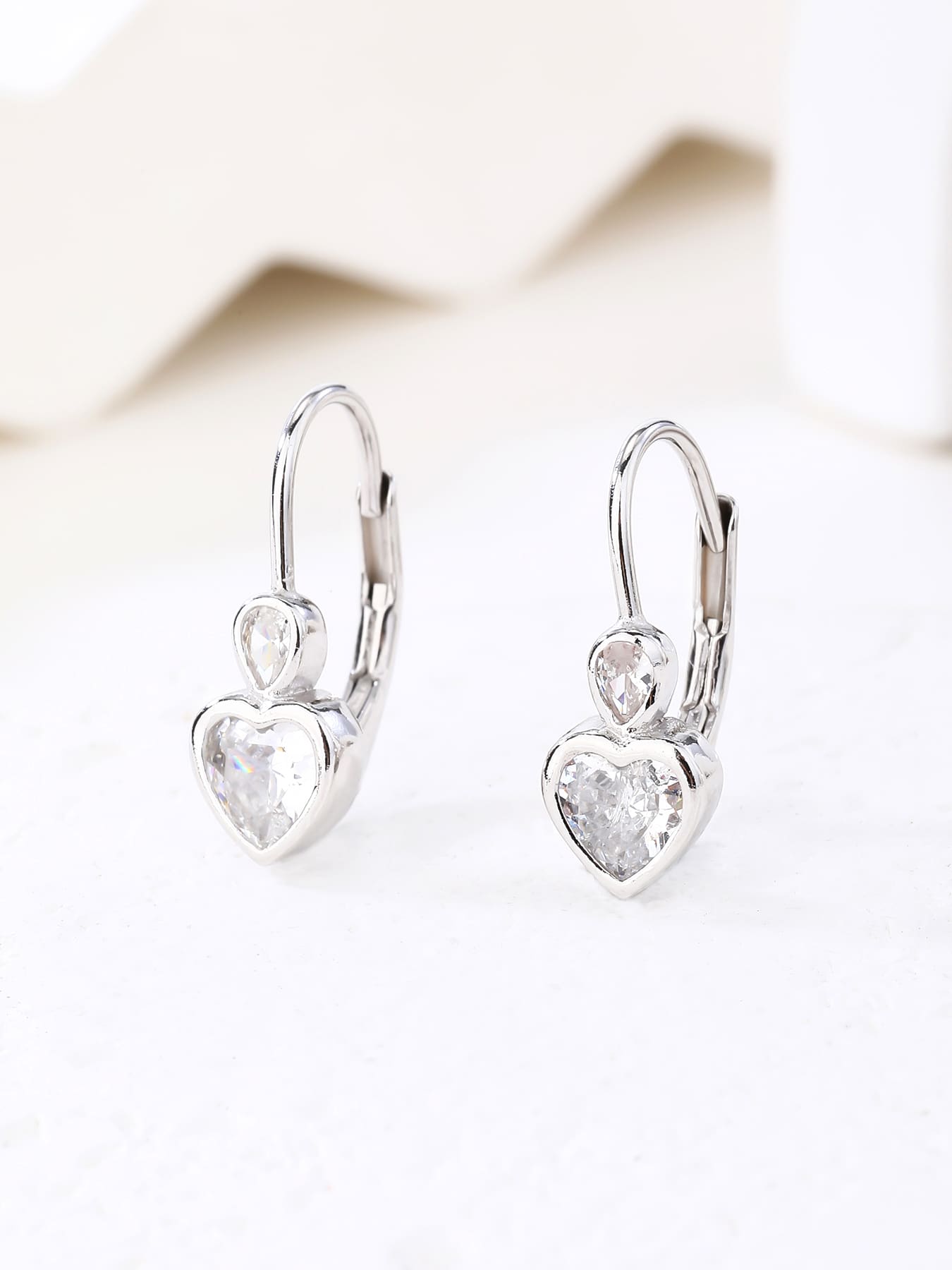 heart-shaped cubic zirconia children’s patent-closure earrings in hallmarked, rhodium-plated 925 sterling silver – display view – DRESCHER Jewellery®