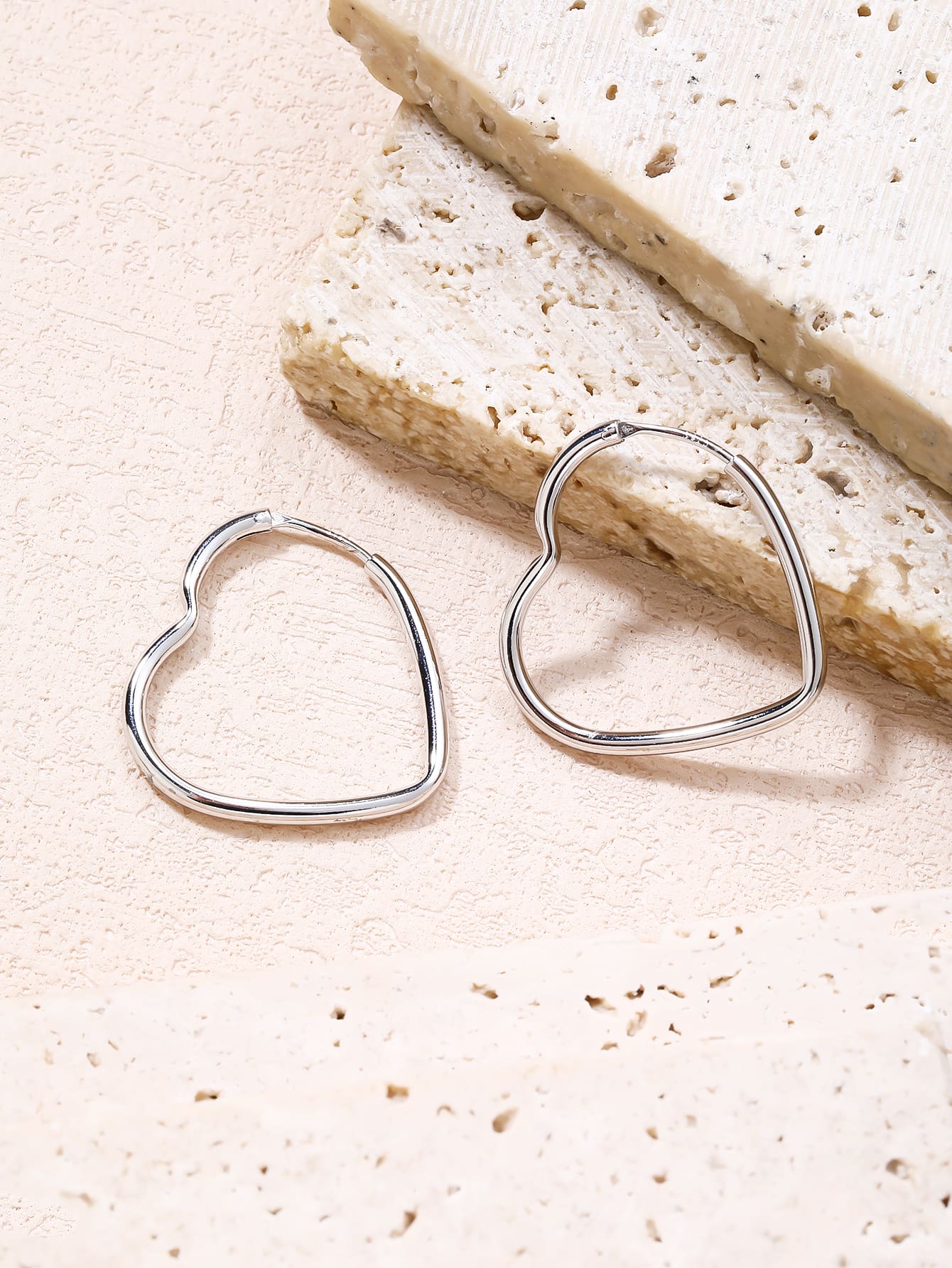heart-shaped hoop earrings in hallmarked, rhodium-plated 925 sterling silver – lifestyle view – DRESCHER Jewellery®