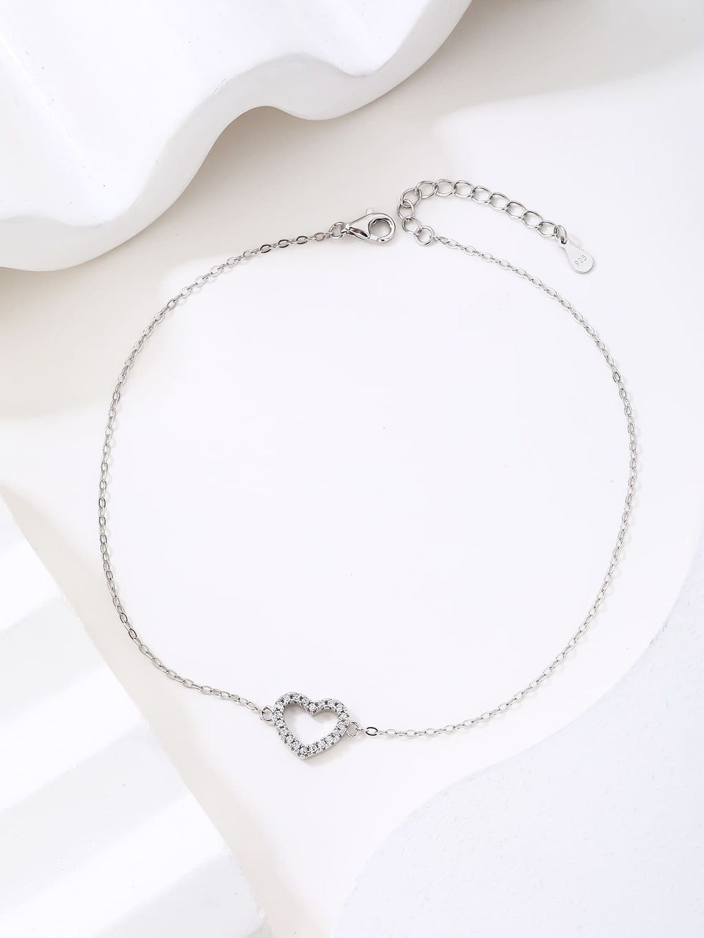 Zirconia stone bracelet with heart motif in hallmarked, rhodium-plated 925 sterling silver – worn view – DRESCHER Jewellery®