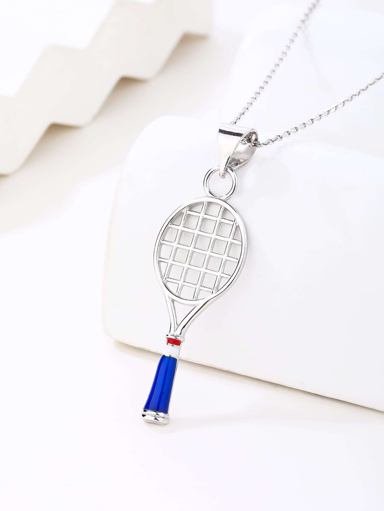 Tennis racket pendant in hallmarked, rhodium-plated 925 sterling silver – display view – DRESCHER Jewellery®