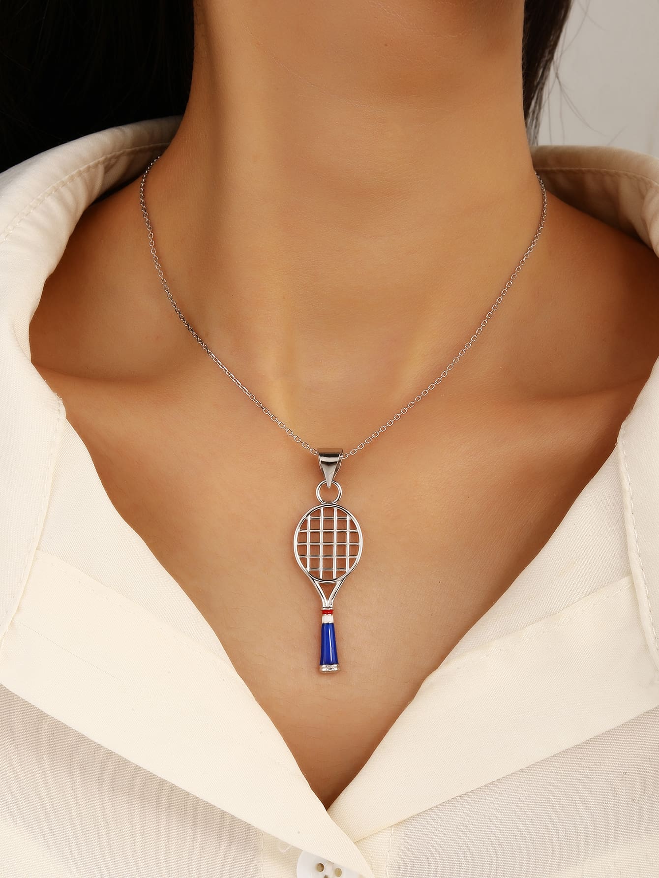 Tennis racket pendant in hallmarked, rhodium-plated 925 sterling silver – worn view – DRESCHER Jewellery®