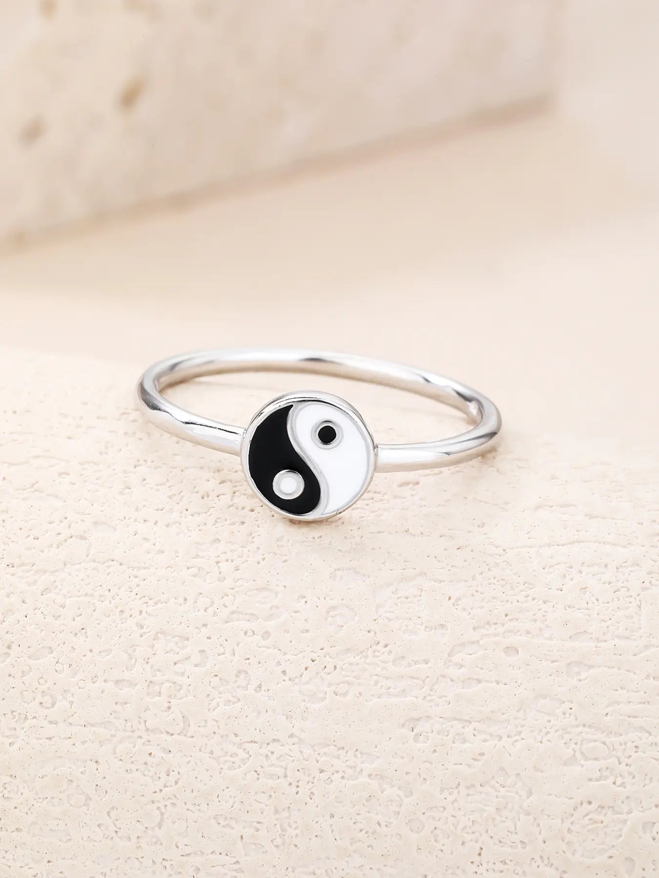 Silver ring with yin-yang symbol