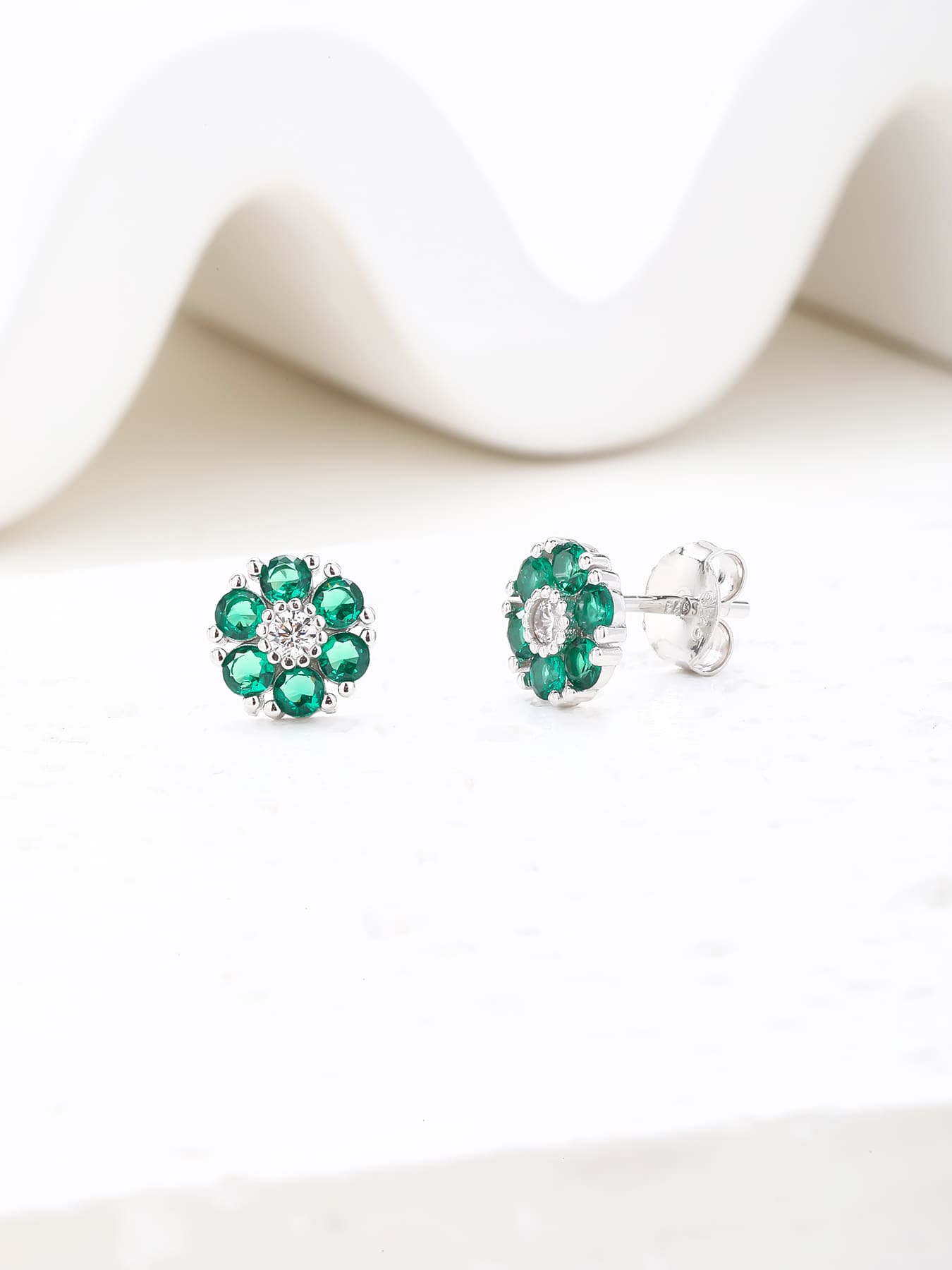 green flower stud earrings in hallmarked, rhodium-plated 925 sterling silver – lifestyle view – DRESCHER Jewellery®