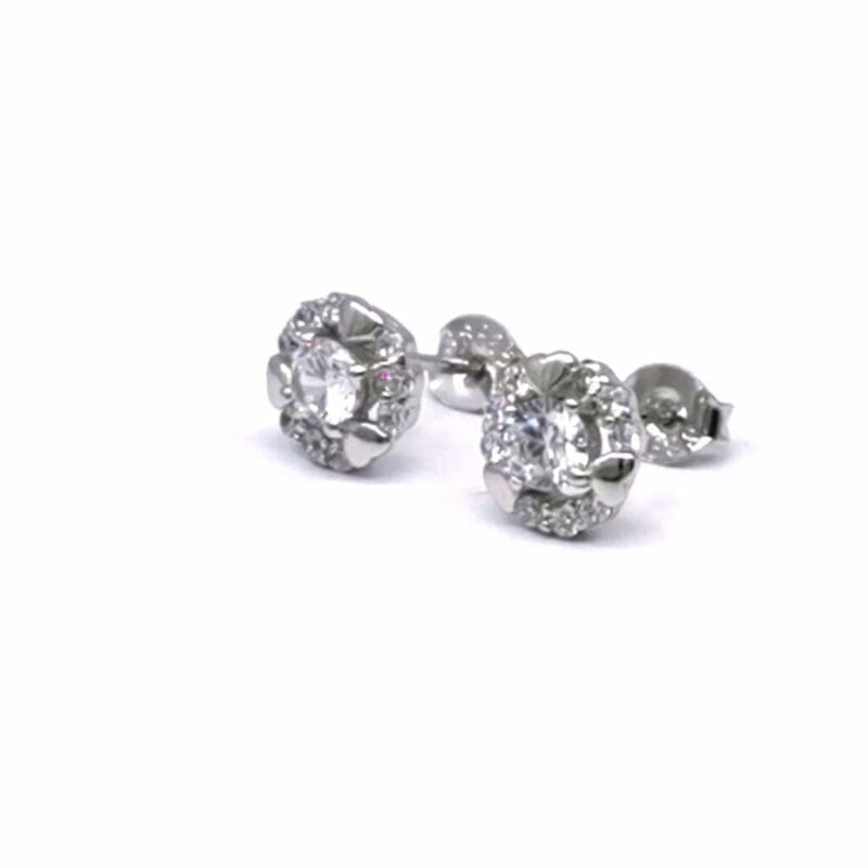 Round halo white stone stud earrings in hallmarked, rhodium-plated 925 sterling silver – angled view – DRESCHER Jewellery®