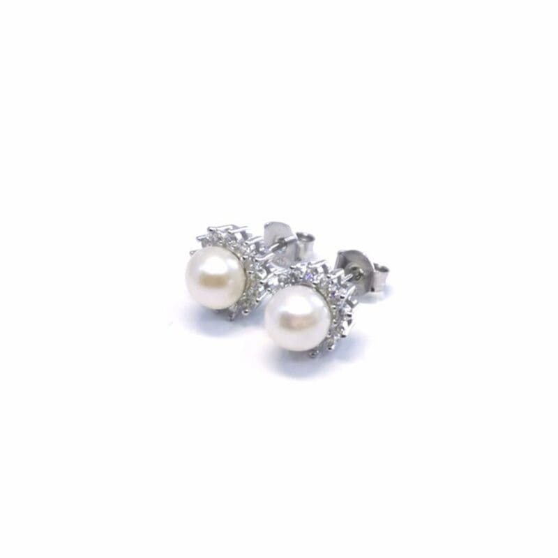 Pearl stud earrings with white stone halos, crafted with hallmarked, rhodium-plated 925 sterling silver – alternate angled view – DRESCHER Jewellery®