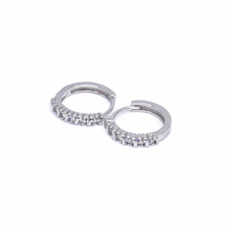 White stone small hoop earrings in hallmarked, rhodium-plated 925 sterling silver – angled view – DRESCHER Jewellery®