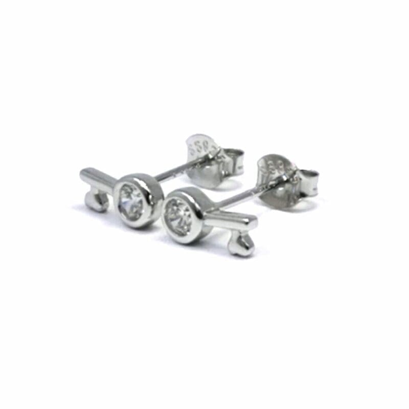 White stone key stud earrings in hallmarked, rhodium-plated 925 sterling silver – angled view – DRESCHER Jewellery®