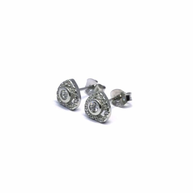 White stone heart stud earrings in hallmarked, rhodium-plated 925 sterling silver – angled view – DRESCHER Jewellery®