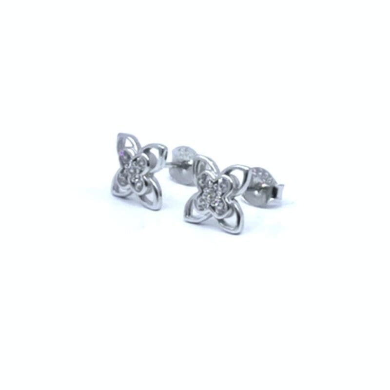 Four-petal white stone flower stud earrings in hallmarked, rhodium-plated 925 sterling silver – angled view – DRESCHER Jewellery®