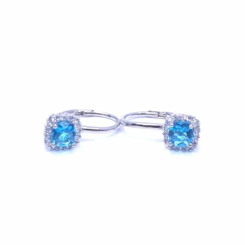 Light blue four-claw stone leverback earrings in hallmarked, rhodium-plated 925 sterling silver – front and side views – DRESCHER Jewellery®