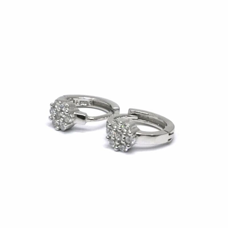 White stone flower-motif small hoop earrings in hallmarked, rhodium-plated 925 sterling silver – angled view – DRESCHER Jewellery®