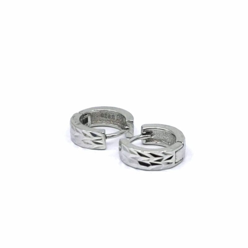 Engraved-line hoop earrings in hallmarked, rhodium-plated 925 sterling silver – angled view – DRESCHER Jewellery®