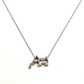 Silver necklace with white stone dog pendant - playful bone in mouth