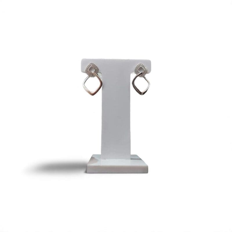 Interlocking open-square white stone drop stud earrings in hallmarked, rhodium-plated 925 sterling silver – display view – DRESCHER Jewellery®
