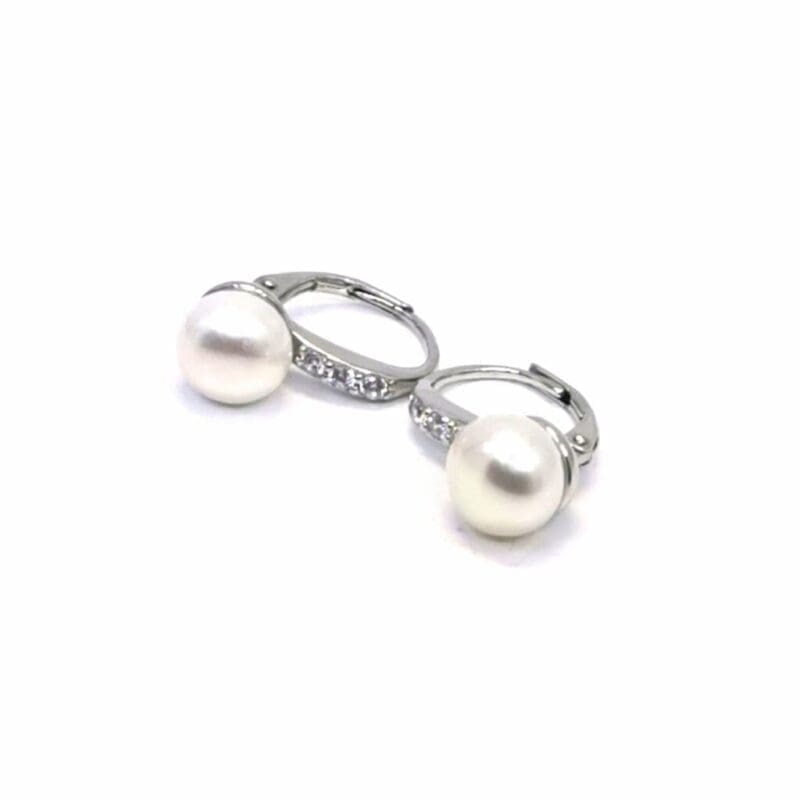 Pearl drop earrings with stone-set leverback closures, crafted with hallmarked, rhodium-plated 925 sterling silver – alternate angled view – DRESCHER Jewellery®