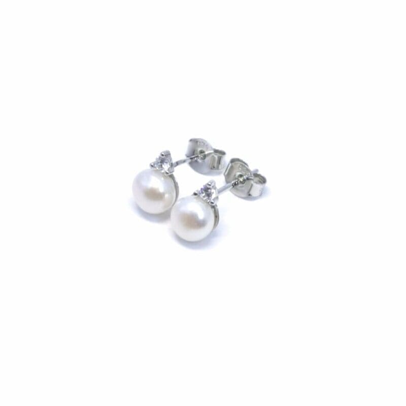 White stone pearl silver stud earrings, with silver components crafted from hallmarked, rhodium-plated 925 sterling silver – alternate angled view – DRESCHER Jewellery®