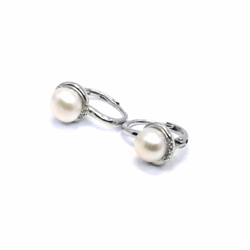 Pearl drop earrings with stone-set leverback closures, crafted with hallmarked, rhodium-plated 925 sterling silver – alternate angled view – DRESCHER Jewellery®