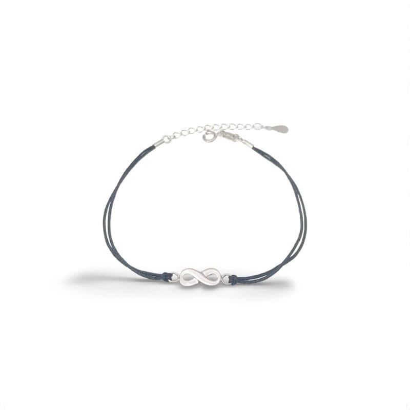 Black cotton anklet with hallmarked, rhodium-plated 925 sterling silver infinity symbol – front view – DRESCHER Jewellery®