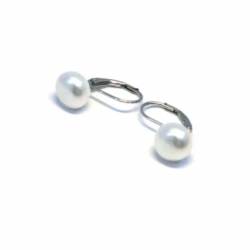 Pearl silver earrings with patent closure, with silver components crafted from hallmarked, rhodium-plated 925 sterling silver – angled set view – DRESCHER Jewellery®
