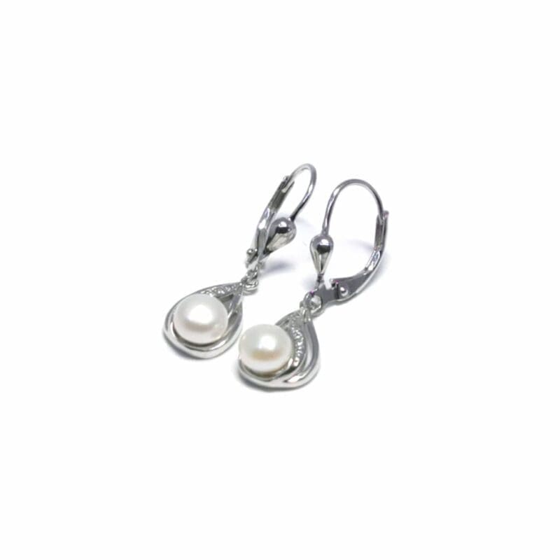 Patent closure white stone pearl hanging earrings, with silver components crafted from hallmarked, rhodium-plated 925 sterling silver – alternate angled view – DRESCHER Jewellery®