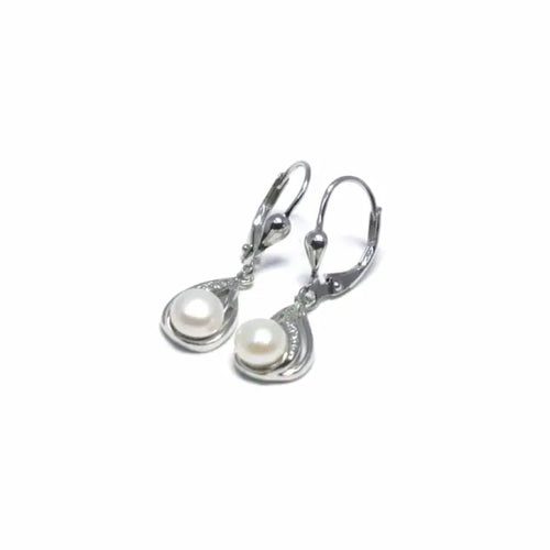 Patent closure white stone pearl hanging earrings, with silver components crafted from hallmarked, rhodium-plated 925 sterling silver – angled view – DRESCHER Jewellery®