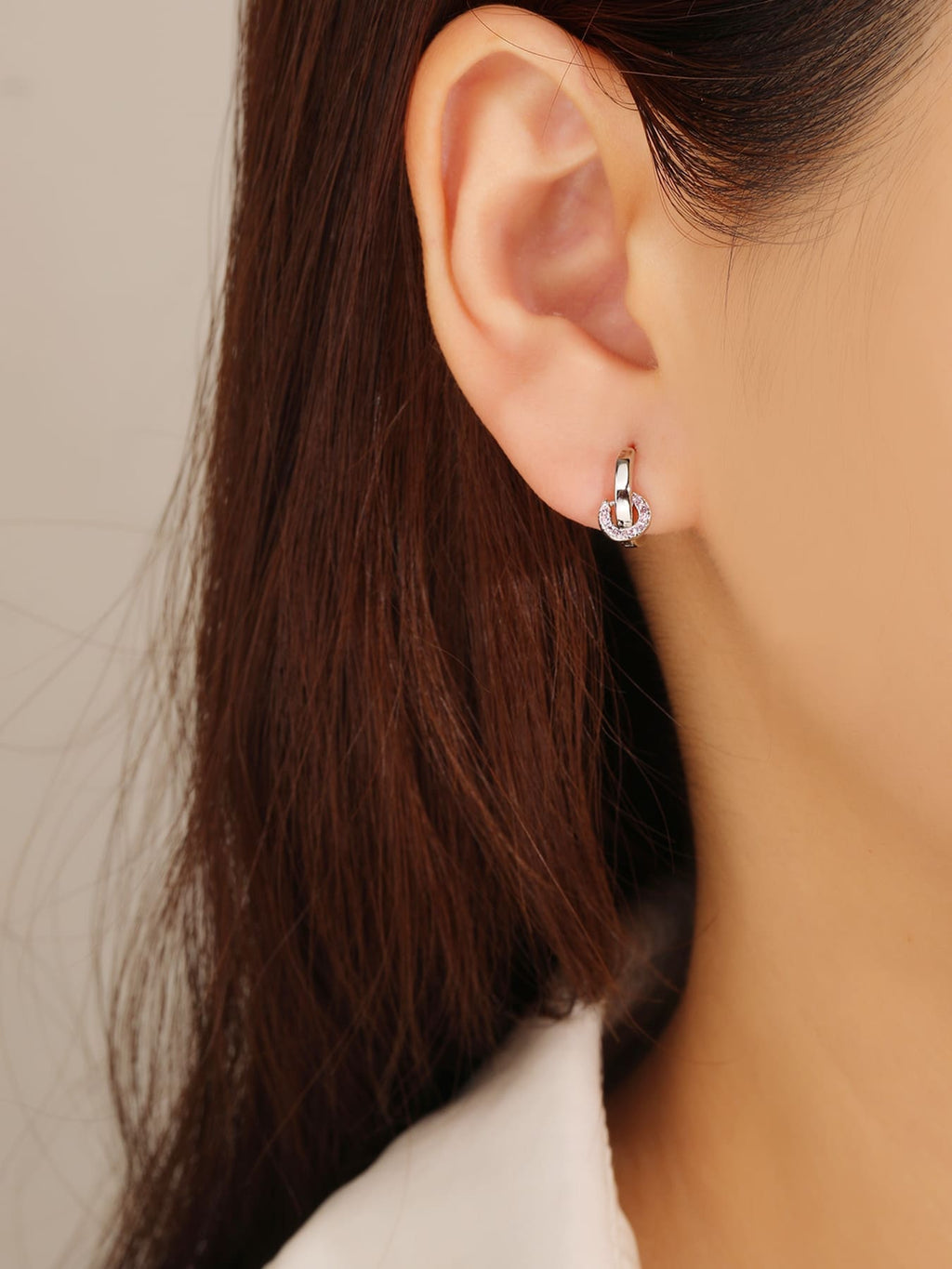 pink zirconia stone hoop earrings in hallmarked, rhodium-plated 925 sterling silver – worn view – DRESCHER Jewellery®