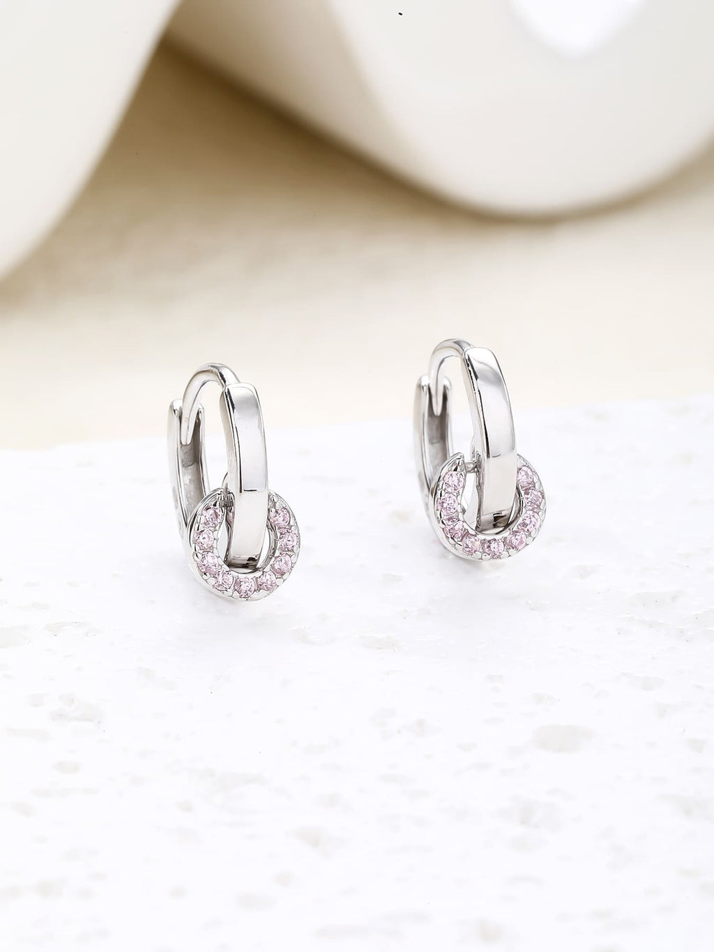 pink zirconia stone hoop earrings in hallmarked, rhodium-plated 925 sterling silver – lifestyle view – DRESCHER Jewellery®